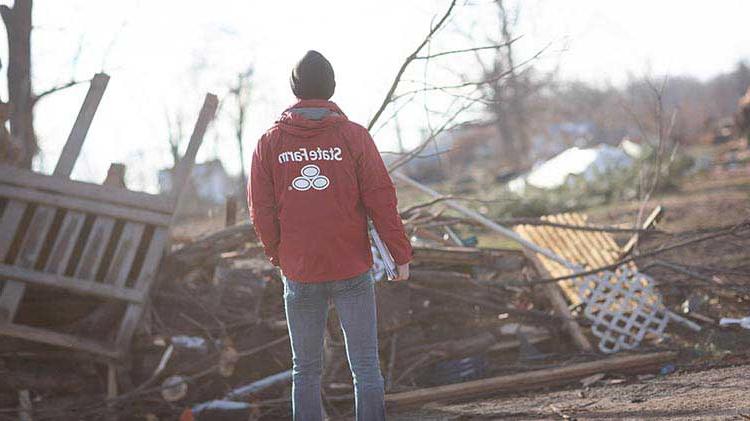 State Farm agent viewing damage after a tornado.